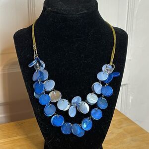 Two tone blue circular disc statement necklace with green leather cord 17-20”